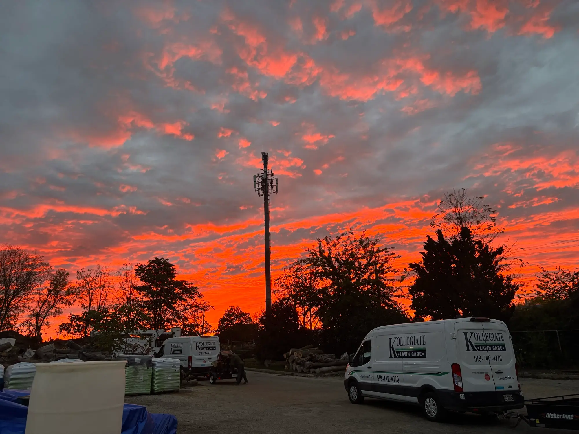 The Kollegiate Lawn Care fleet at our Kitchener yard at sunset